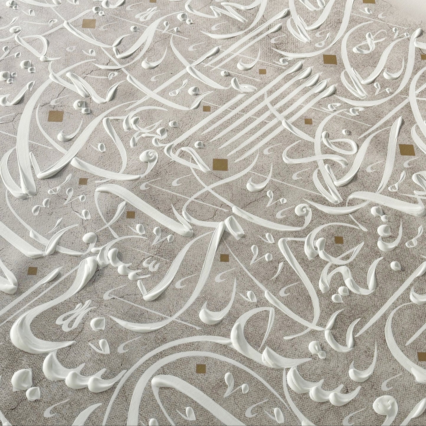 Close-up of intricate hand painted Arabic calligraphy on canvas.
