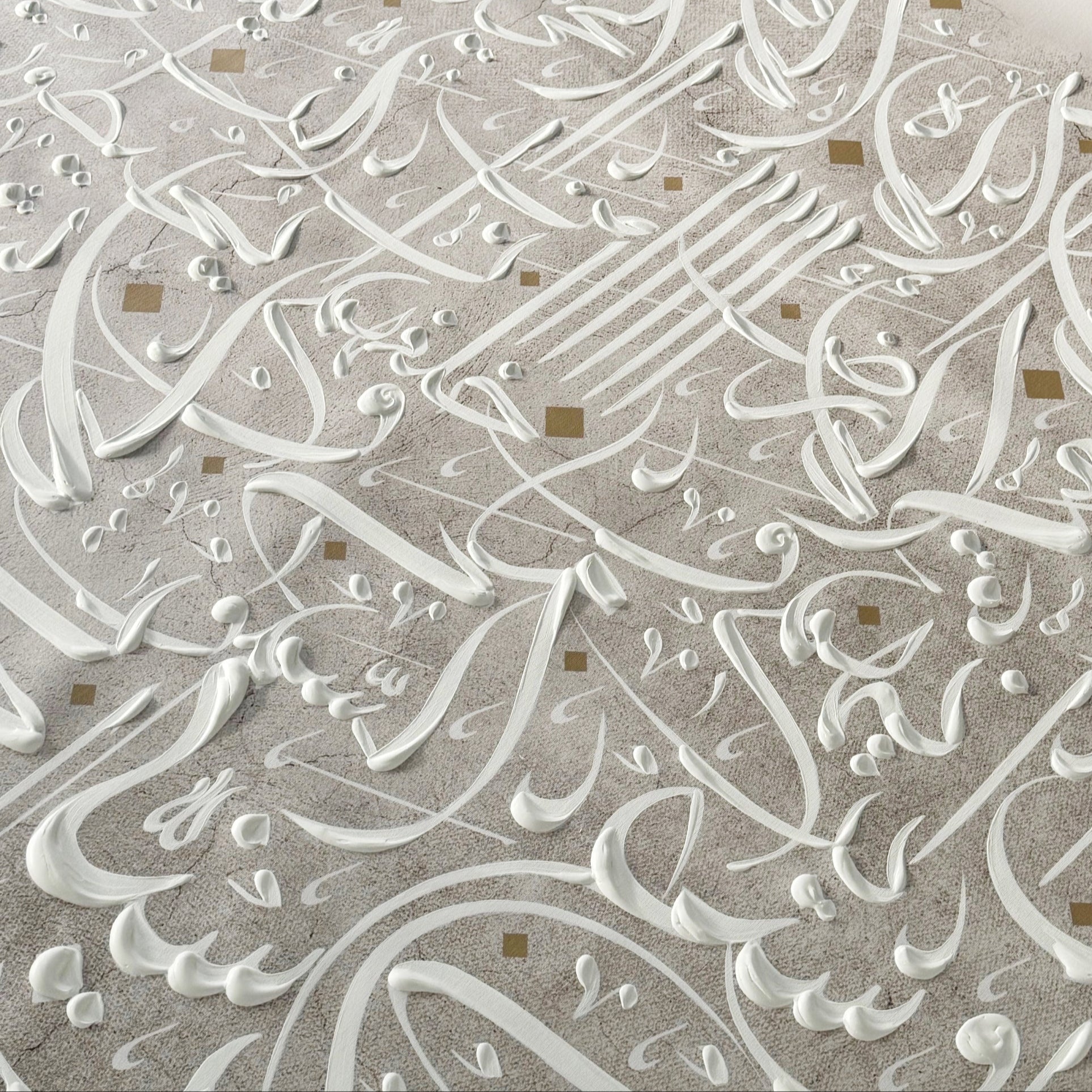 Close-up of intricate hand painted Arabic calligraphy on canvas.